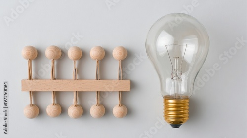 Light bulb and wooden balls symbolize different ideas