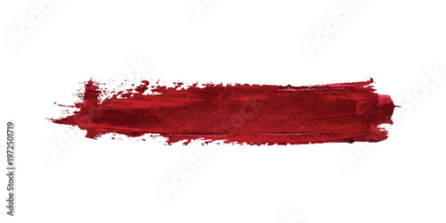 Horizontal deep red paint brush stroke with textured edges isolated on a white background showing thick pigment layers and dry brush marks