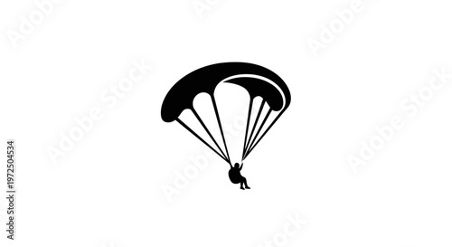 Silhouette of a paraglider soaring against a white background