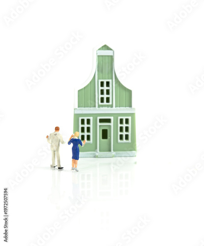 Couple Looking At Model House Concept For Home Buying And Real Estate Decision