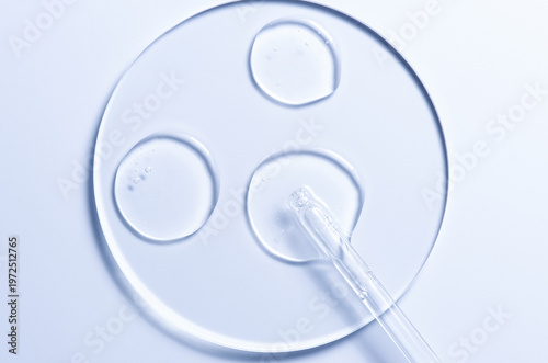 Skin serum or moisturizer or shower gel on a glass circle. A cosmetic product for body care.