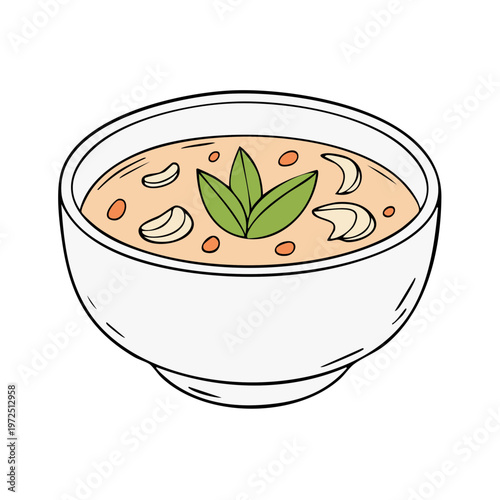 Delicious bowl of creamy soup with garnishes and fresh leaves