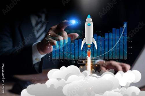 Businessman working on virtual touch screen pointing flying rockets boost startups. Boost business growth, business and financial growth, progress or development concept