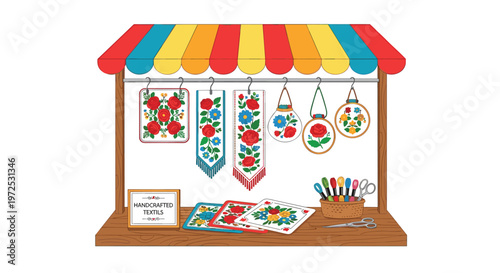 A vibrant wooden market stall displays meticulously handcrafted floral embroidery hoops and colorful textile patterns under a bright striped awning on a clean white background.