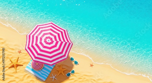Top view of a beach umbrella, towel, and sunglasses on sandy shore with ocean waves