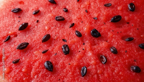 Close-Up of Fresh Watermelon Slice Showing Delicate Red Flesh and Glossy Black Seeds