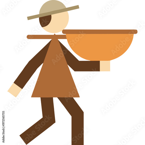 A person walks while carrying a large bowl on their shoulder outdoors.