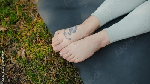 Woman meditates, relaxes and make yoga exercises in the woods alone