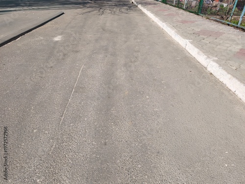Empty asphalt road perspective with painted line showing urban street surface and transportation path in outdoor environment realistic composition scene