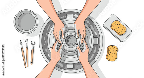 Top view of hands working on a pottery wheel, making a clay bowl with tools and sponges nearby for creative artisan craft.
