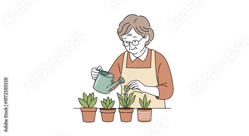 Kind elderly woman wearing glasses and an apron using a small green watering can to care for several potted plants on a table.