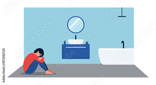 A distressed woman wearing a vibrant red sweater sits curled up on the cold grey floor of a minimalist blue bathroom near a white porcelain bathtub in a state of grief.