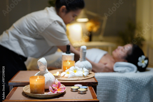 Billede på lærred Aromatherapy massage ambiance or spa salon composition setup, focus decor candle
