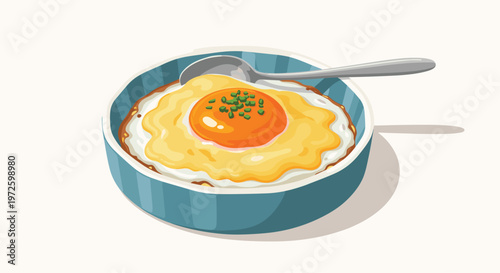 A delicious fried egg garnished with fresh chopped green chives is served in a textured blue ceramic dish accompanied by a sleek silver metal spoon.