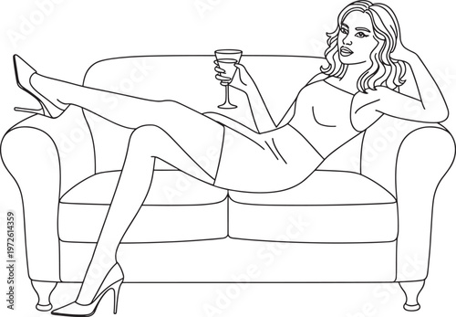 Woman reclining on sofa wearing high heels and holding cocktail