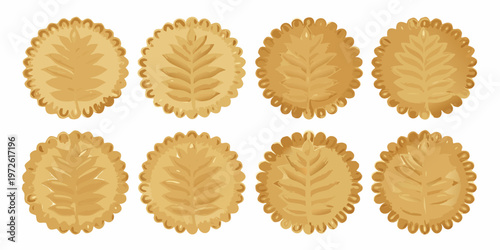 Eight golden biscuits arranged in a grid displaying detailed leaf patterns