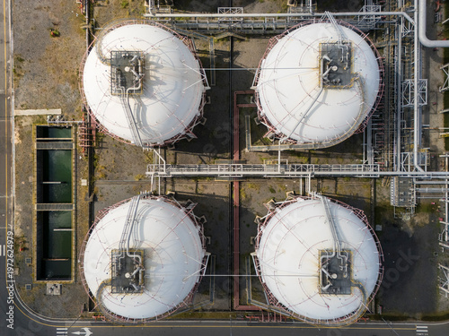 Aerial Top-down View of Four Spherical Industrial Storage Tanks in a Chemical Plant