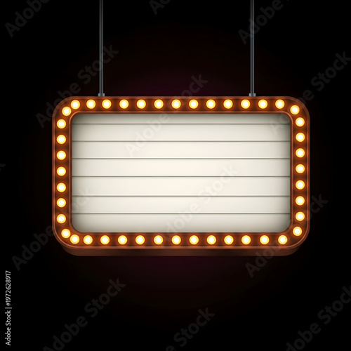 Vintage illuminated movie marquee sign with empty space for text, suspended in a dark setting. Empty billboard display with warm incandescent lighting.