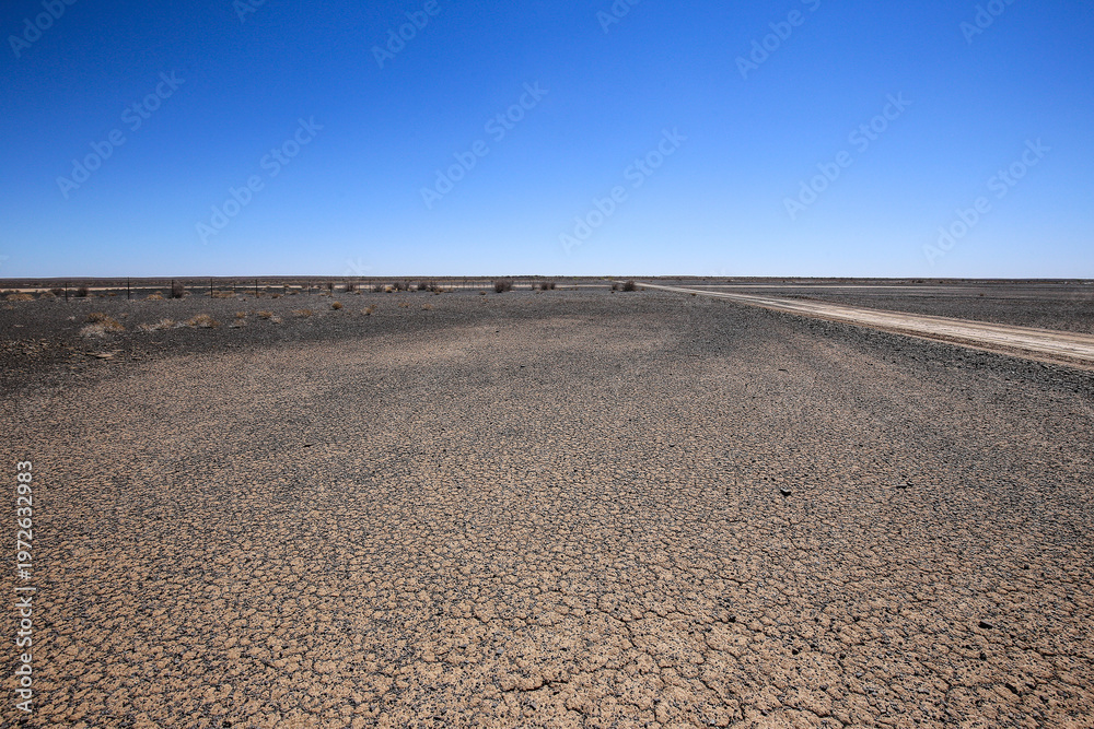 Fototapeta premium Desolate flat area near Verneukpan where land speed records were performed, Northern Cape, South Africa