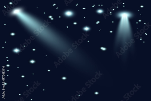 Dramatic spotlight effect stunning blue light beams and sparkling particles on dark background