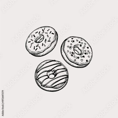 Hand drawn sketch of three decorated donuts