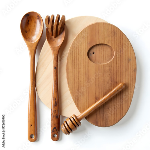 Artisan wooden kitchenware set with honey dipper and spoon isolated on white.