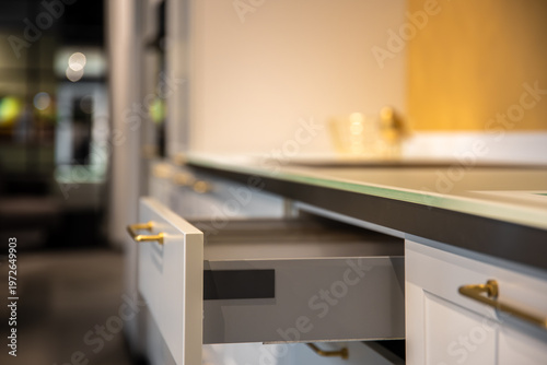 Photos Open kitchen drawer in modern interior close up