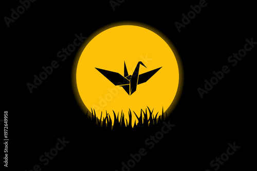 Silhouetted crane flies against golden moon. Grass blades frame the scene beneath. Calm night air holds still and quiet. Symbol of peace, grace, and serenity. Ideal for tranquil or spiritual themes