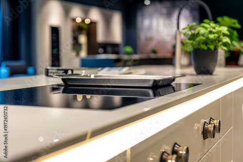 Fotografie Modern induction hob on white countertop