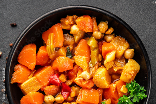 Stewed vegetables ragout potatoe, carrot, chickpea, onion, zucchini, pumpkin tasty snack fresh gourmet food background on the table rustic food top view copy space keto and paleo diet vegetarian 