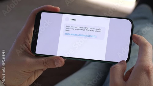 Person reading suspicious message with link on smartphone screen. Online scam, phishing attempt and cybersecurity awareness concept. Perfect footage for digital security campaigns, fraud prevention
