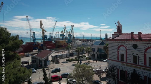 Aerial view of a 1930s architectural sculpture of a goddess on a ship prow, Port of Durres.
