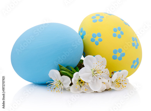 Two handmade Easter eggs blue and yellow isolated on white background