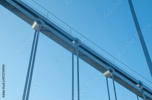 Pinned hanger connection on a steel bridge in blue sky close up