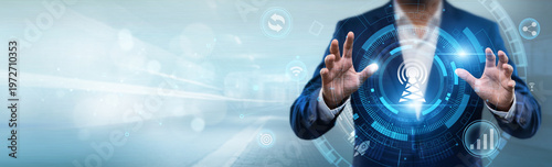 Businessman holding telecommunications interface with networking data, communication networks, wireless technology, global connectivity and digital infrastructure concept