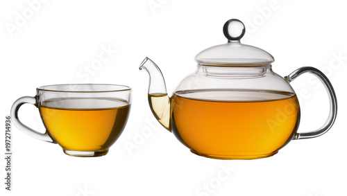 Photos Isolated elegant glass teapot and matching teacup filled with delicious hot ambe
