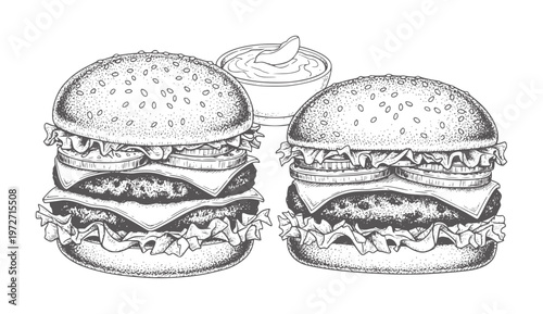 Two black and white hamburgers with a side of dipping sauce food