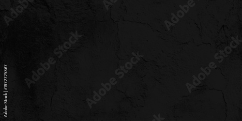 A dark aged concrete wall with a rough grey stone texture and dirty vintage pattern creates a blank grunge wallpaper backdrop for a textured design