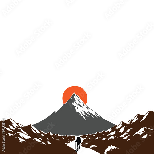 Lone hiker walks towards majestic snow capped mountain at sunrise.