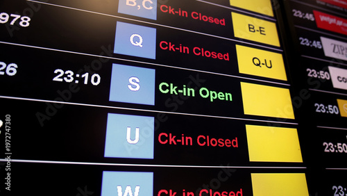Airport display board. Airport departure information board displaying boarding gate open check in status and cancelled flights. Ideal for travel aviation tourism delay and transportation concepts.