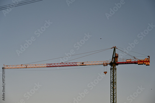 fishing boats in port, construction site with crane