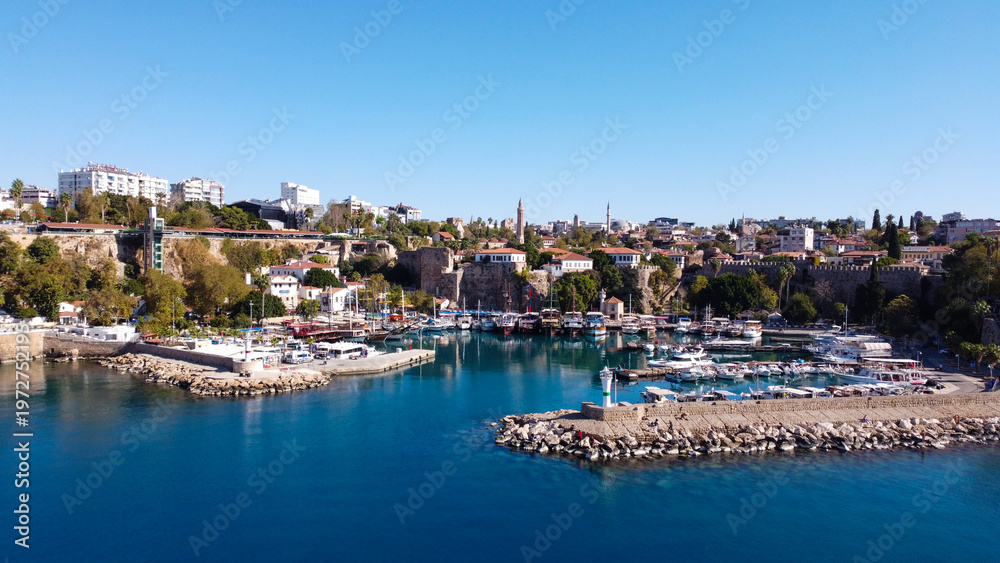 Naklejka premium Aerial High Angle View of Historic Kaleici Old Harbor with Yachts and Lighthouse in Antalya Turkey