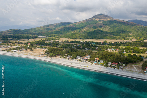 Scenic Panorama Aerial Drone Picture of the crystal clear water and the beach and Mount Katung-uhan in Botolan, Zambales in the Philippines 