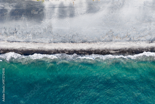 Scenic bird's eye top down view of the crystal clear water and the beach and in Botolan, Zambales in the Philippines 