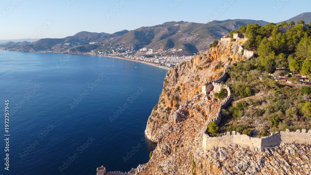 Naklejka premium Aerial Panoramic View of Historic Alanya Castle Walls with Kleopatra Beach and City Skyline in Antalya Turkey