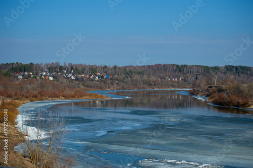 Frozen River Bends Under Blue Sky
