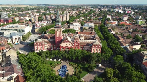 A drone slowly rotates to reveal monumental Art Nouveau facades in central Subotica, Serbia.