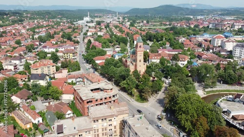 Drone flying forwards over Paracin revealing orange rooftops of this historic town in central Serbia.