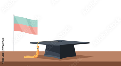 Graduation cap with flag on table: celebrating academic achievement