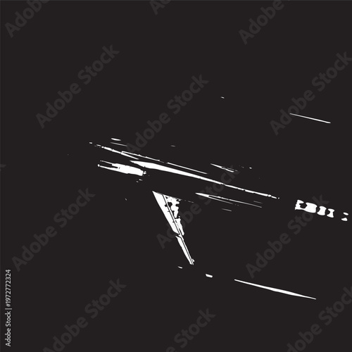 High contrast black and white close up of modern car dashboard interior at night with steering wheel with instrument panel with light trail